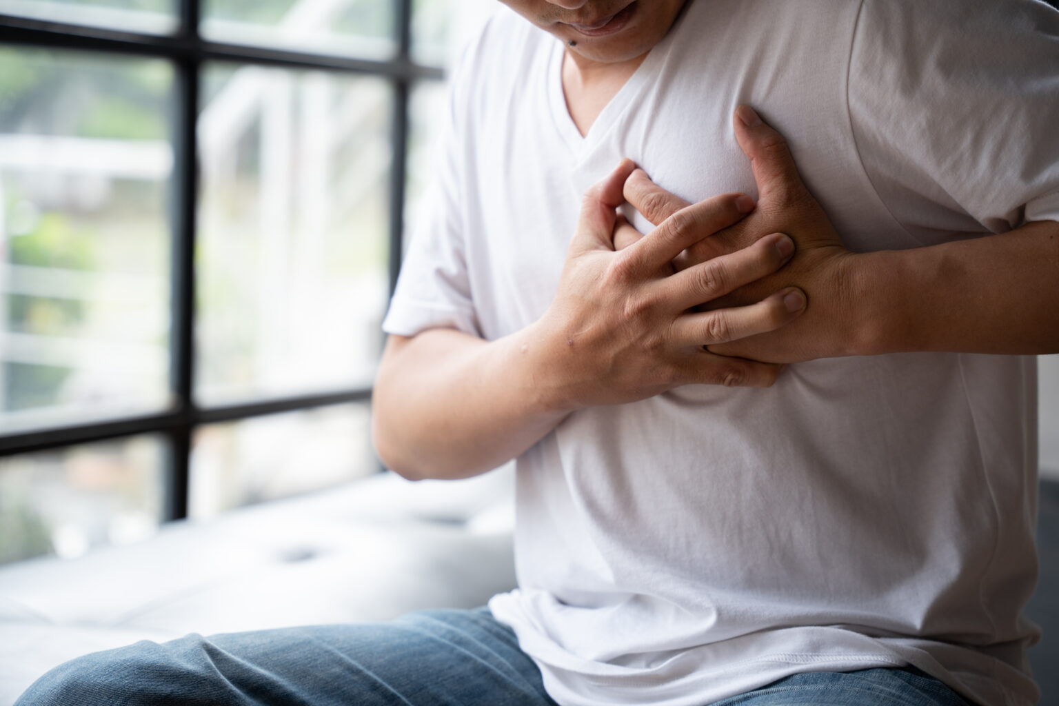 Image Hands holding chest with symptom heart attack disease, Man With